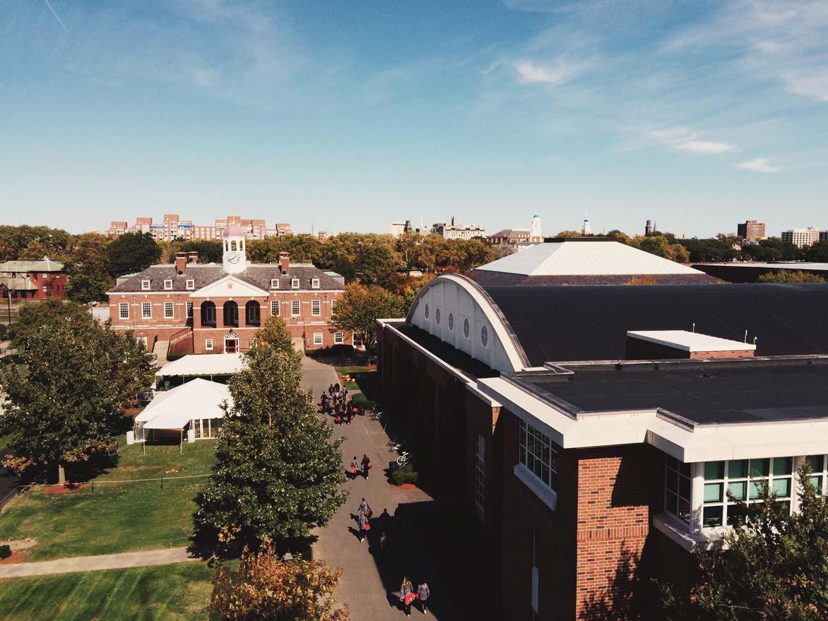 Arial photograph of the Harvard University campus with students walking along the walkways