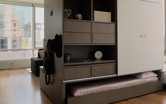 View of the ORI Modular bedroom system. Mattress rolled under the closet and shelves